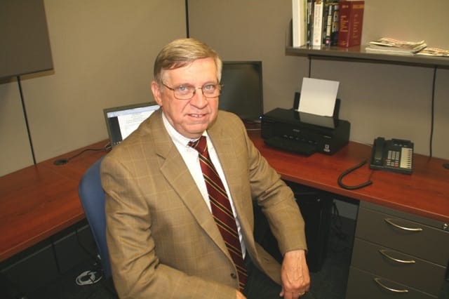 dave moore sitting at desk